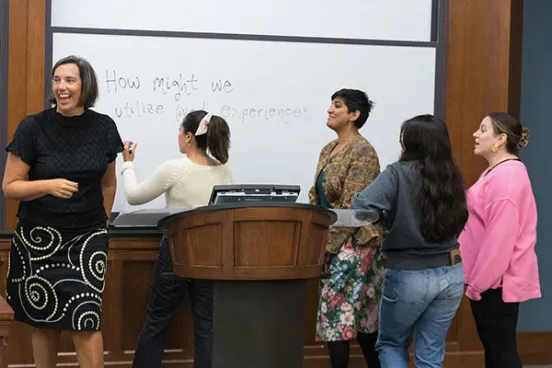 Professor Bridgette Carr teaching students in a classroom.