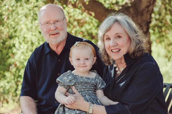 Ambassador W. Robert Kohorst, ’78, with his wife, Shelley Allen, and their granddaughter, Audrey.