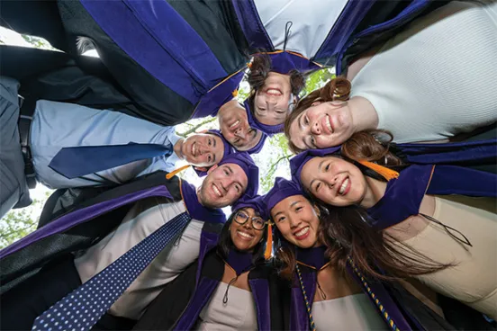 Michigan Law students huddled together on Senior Day Michigan Law students huddled together on Senior Day