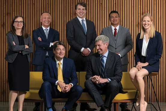 Sean Grimsley, ’00, and Eric Olson, ’00, with members of their team at Olson Grimsley.