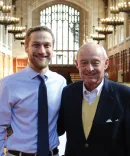John Boyles with recipient in law library