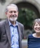 Julie Metzger and Sam Bufford standing in front of building