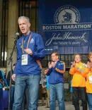 Tom Grilk, ’72, addresses runners and supporters at the 2014 Boston Marathon.