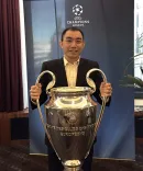  Li poses with the Union of European Football Associations’ championship trophy.