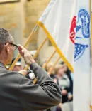 Veterans saluting during the ceremony