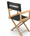 A film chair with the word attorney written on the back