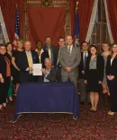 Alumnae Claire Nagel, ‘18, and Lauren Fitzsimons, ‘17, and Clinical Assistant Professor of Law Steve Gray joined Michigan Gov. Rick Snyder, ‘82, during the December 2017 bill-signing session implementing new unemployment insurance legislation.