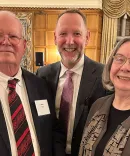 Faculty gathered in March for a pandemic-delayed celebration of Bruce Frier and Christine Whitman’s retirements. They are pictured at the dinner with Dean Mark West (center).