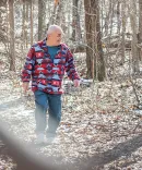 Jeff Titus walks in the woods after being exonerated.