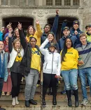 Group of people posing together.