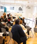 Student speaking in front of a group of people