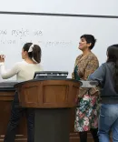 Professor Bridgette Carr teaching students in a classroom.