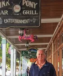 R. Charles McLravy II, ’77, in front of the Pink Pony on Mackinac Island.