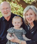 Ambassador W. Robert Kohorst, ’78, with his wife, Shelley Allen, and their granddaughter, Audrey.